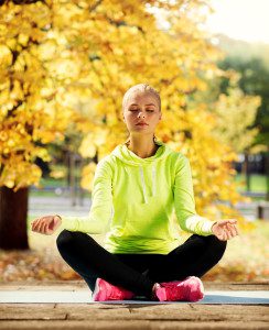 woman doing yoga outdoors